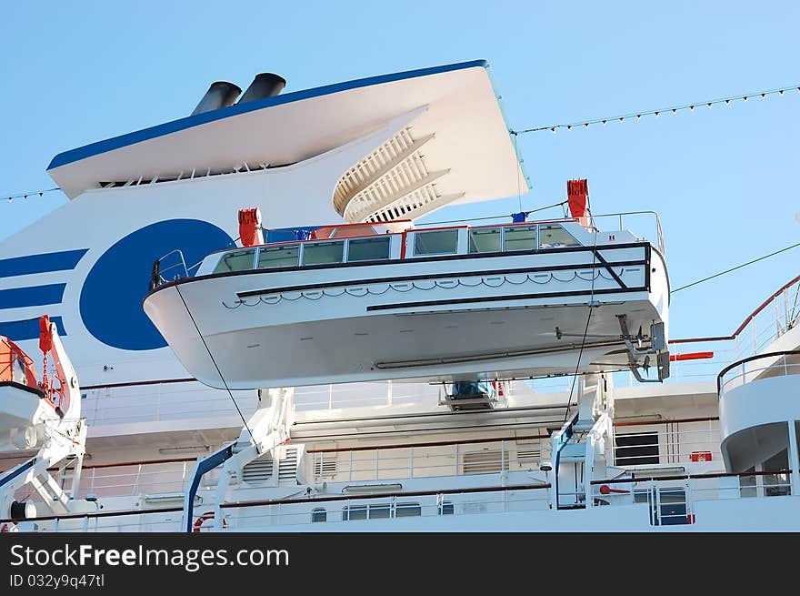 The saving boat attached to the big liner