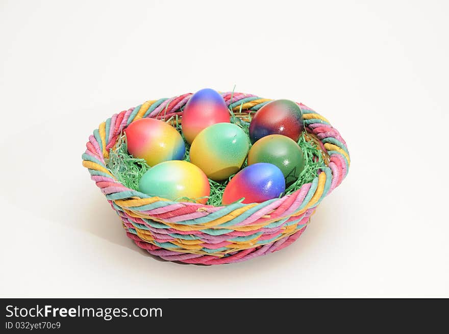 Coloured easter eggs in a basket