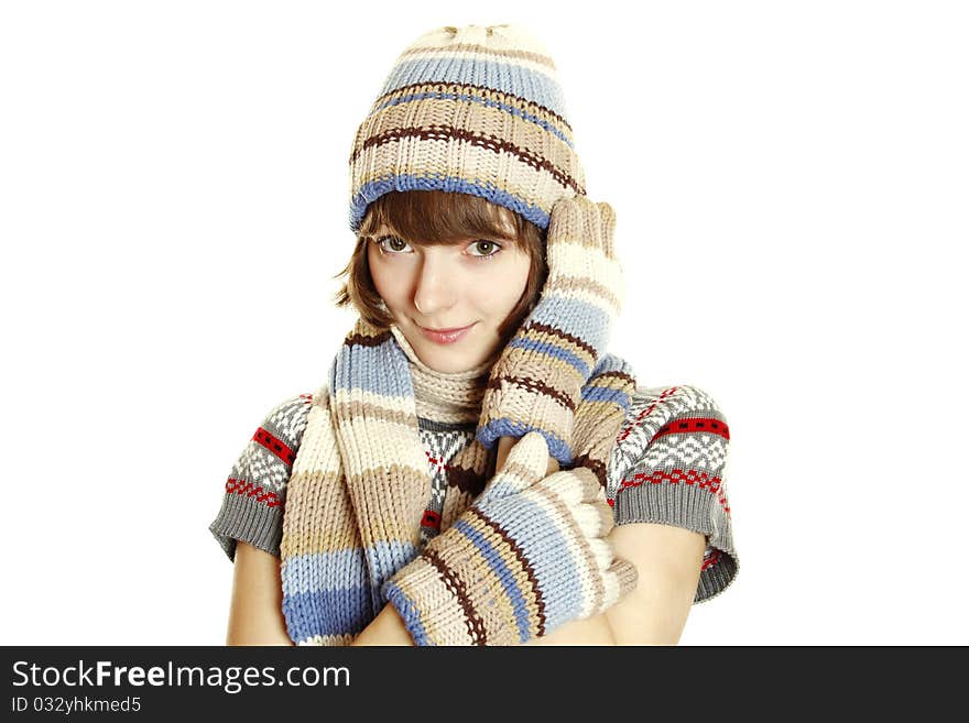 Photo of a young woman in soft sweater, cap and mittens. Isolated on a white background. Photo of a young woman in soft sweater, cap and mittens. Isolated on a white background