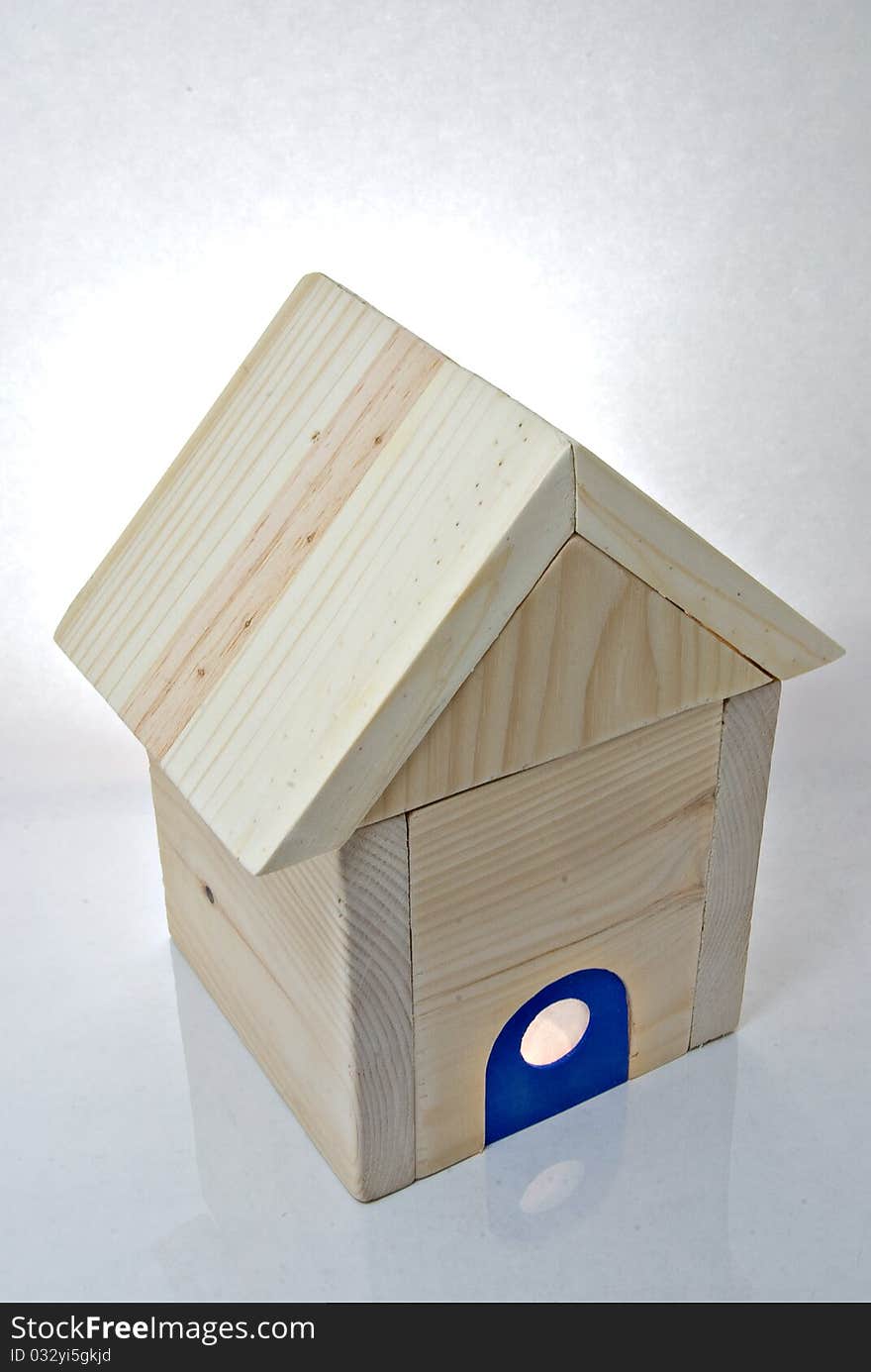 Miniature wooden house with blue front door. Miniature wooden house with blue front door