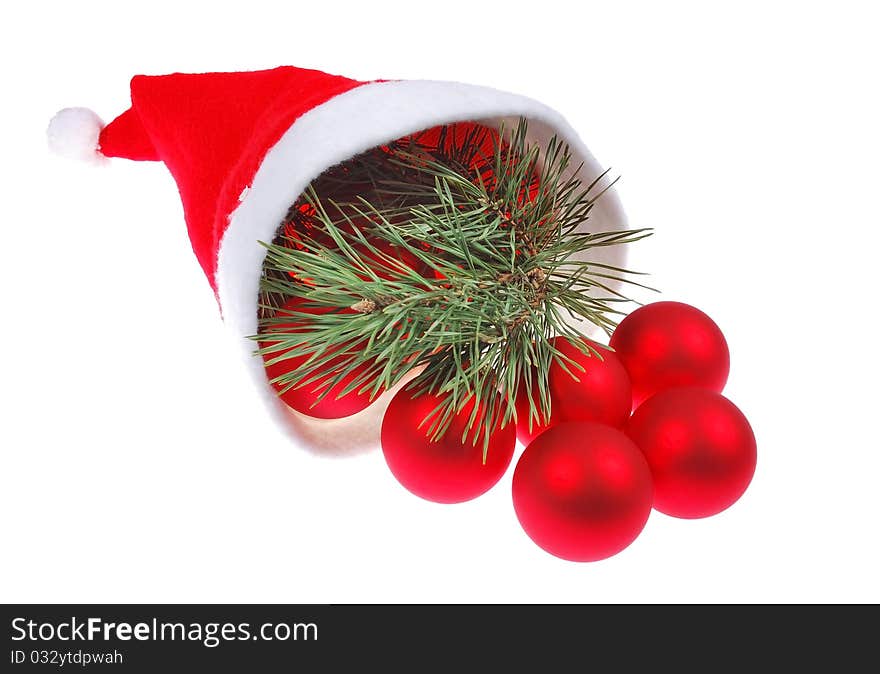 Santa hat and red christmas balls isolated on white background