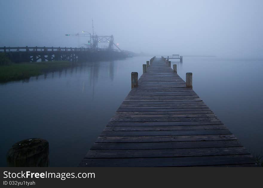Fishing pier going into fog