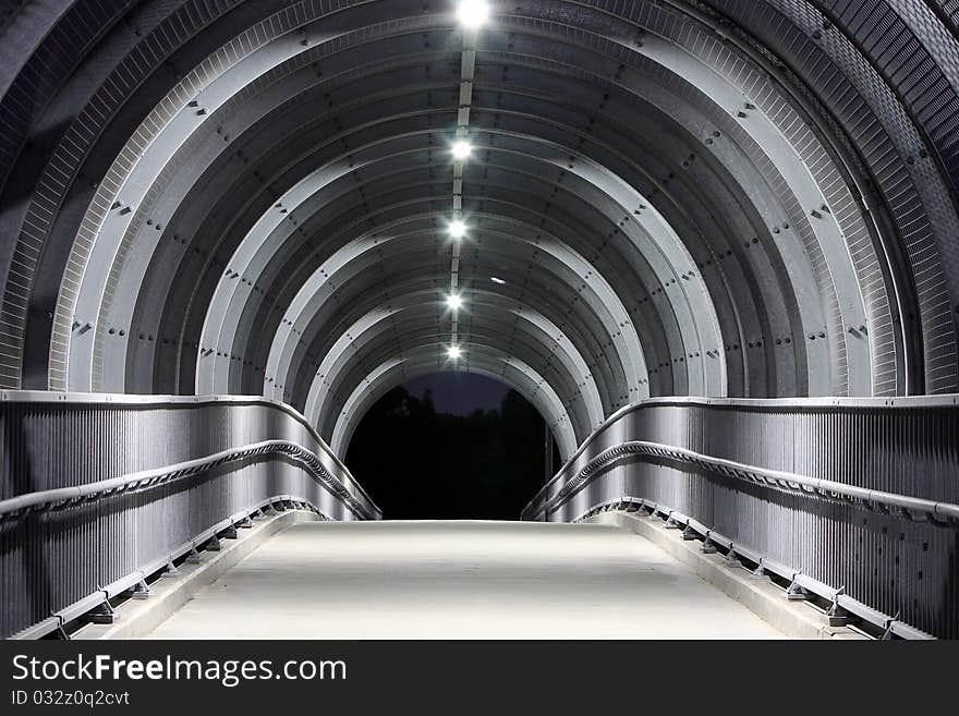 Concrete and steel pedestrian bridge.