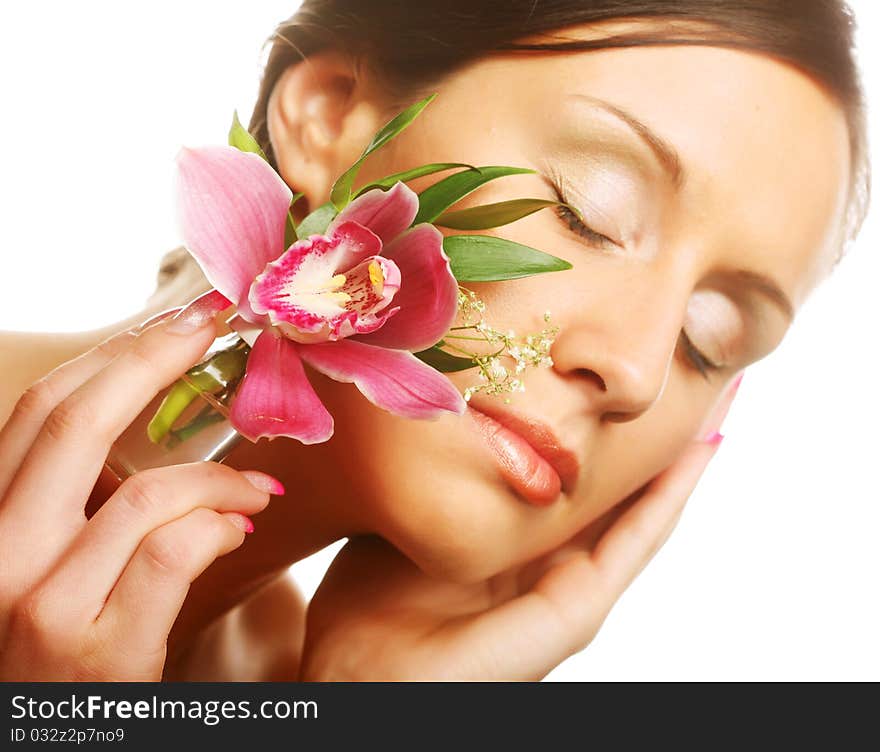 Beautiful girl holding orchid flower in her hands. Beautiful girl holding orchid flower in her hands