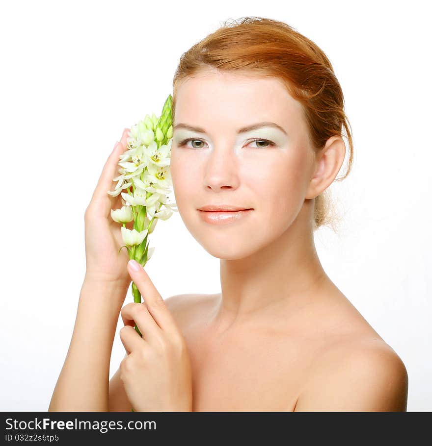 Young cute woman with fresh white flower