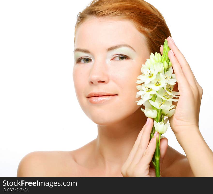 Young cute woman with fresh white flower