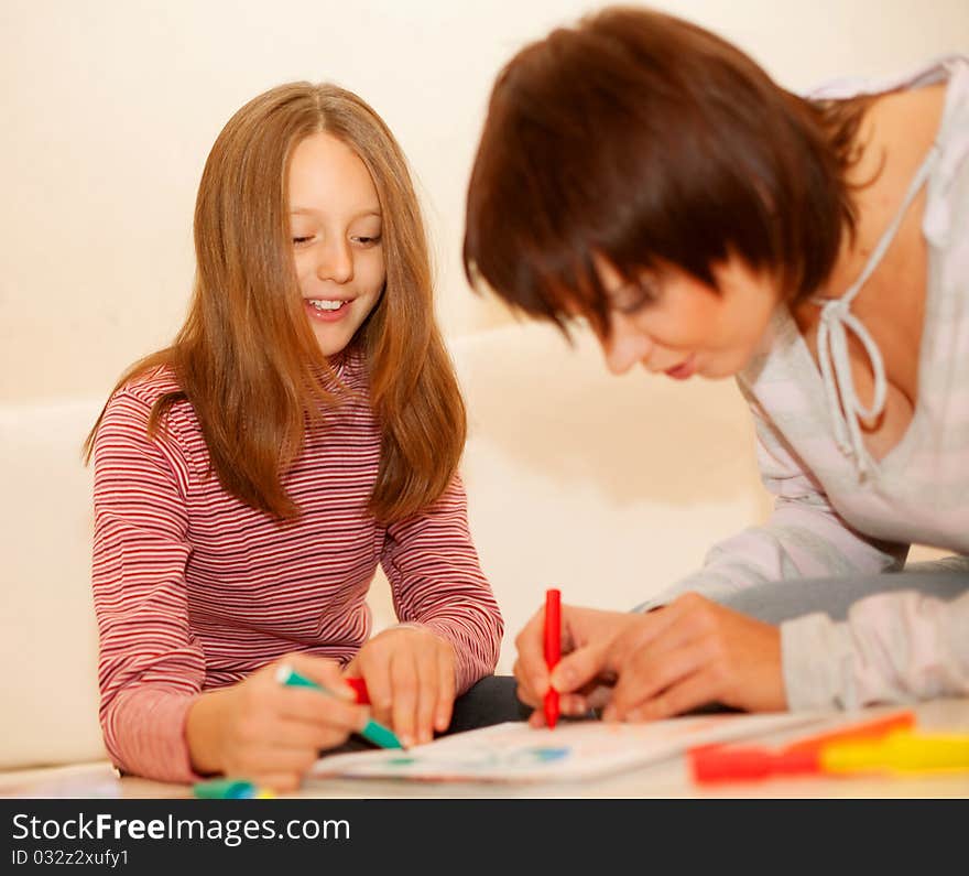 Mother and little girl painting. Mother and little girl painting