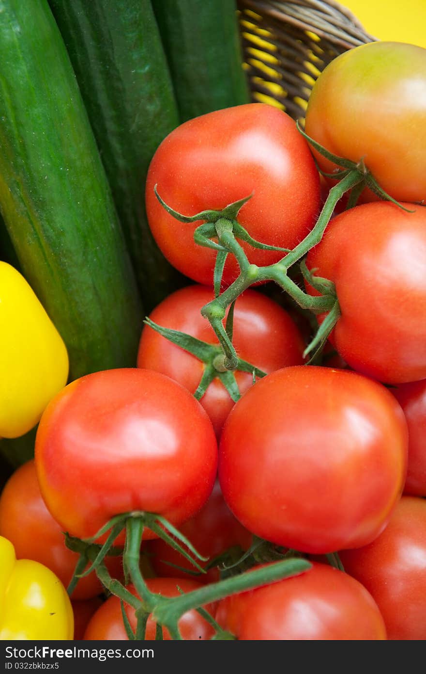 Salad basket with tomato's, cucumbers, and yellow pepper. Salad basket with tomato's, cucumbers, and yellow pepper