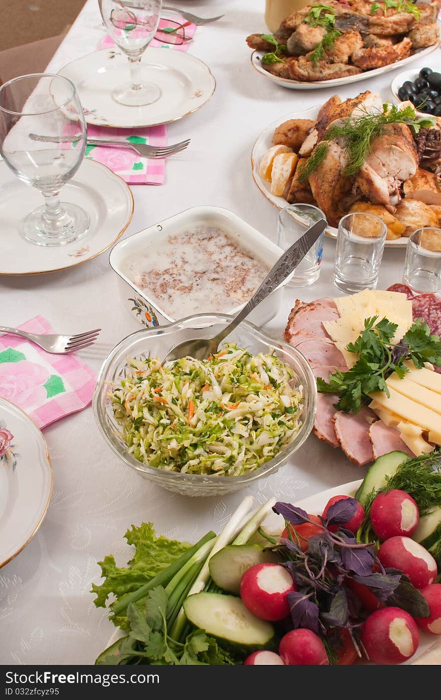 The prepared meat, fish and vegetables on a dining table. The prepared meat, fish and vegetables on a dining table.