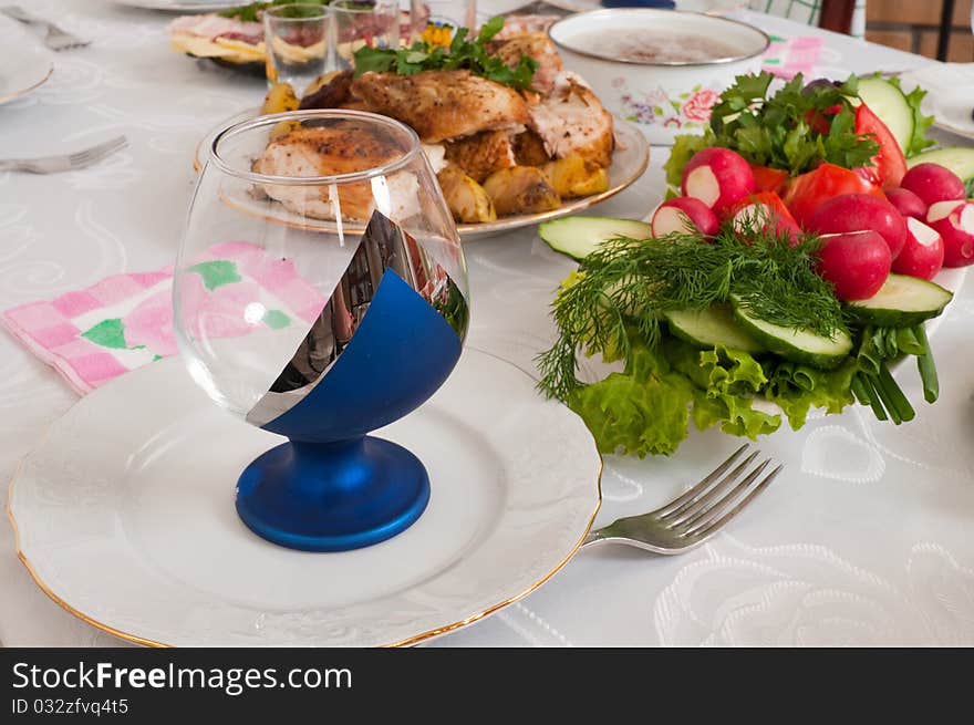 The prepared meat, fish and vegetables on a dining table. The prepared meat, fish and vegetables on a dining table.