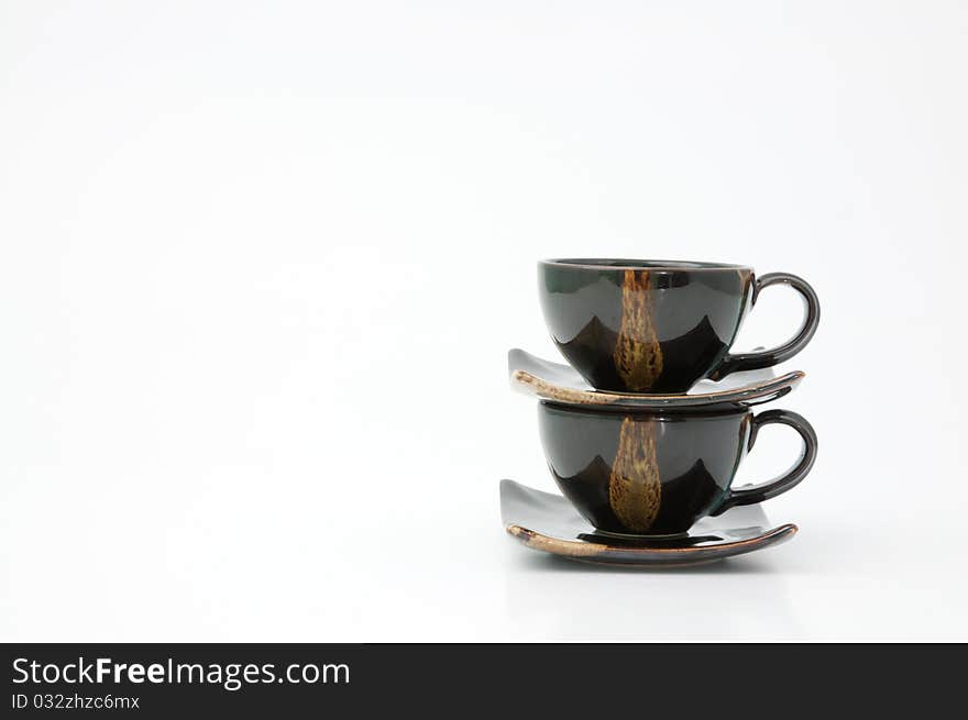 Stack of ceramic glass on white background