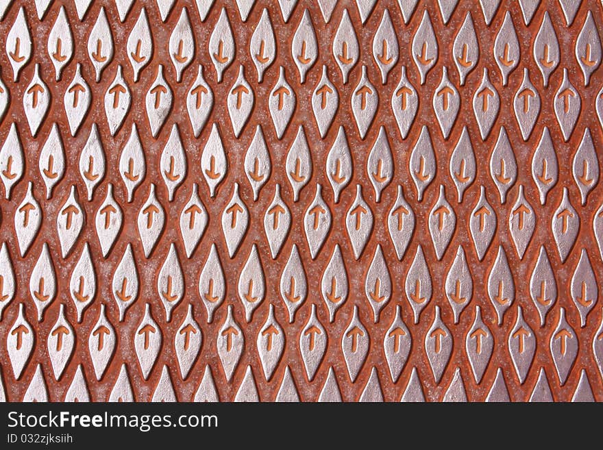 Leaf-like pattern on a steel manhole cover. Leaf-like pattern on a steel manhole cover.