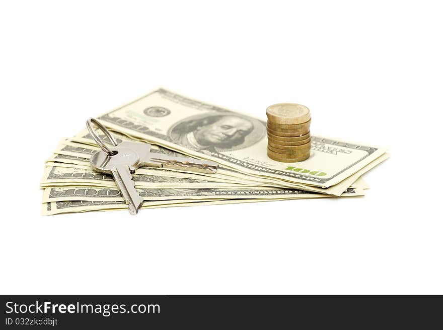 Keys and stack of dollars isolated on a white background