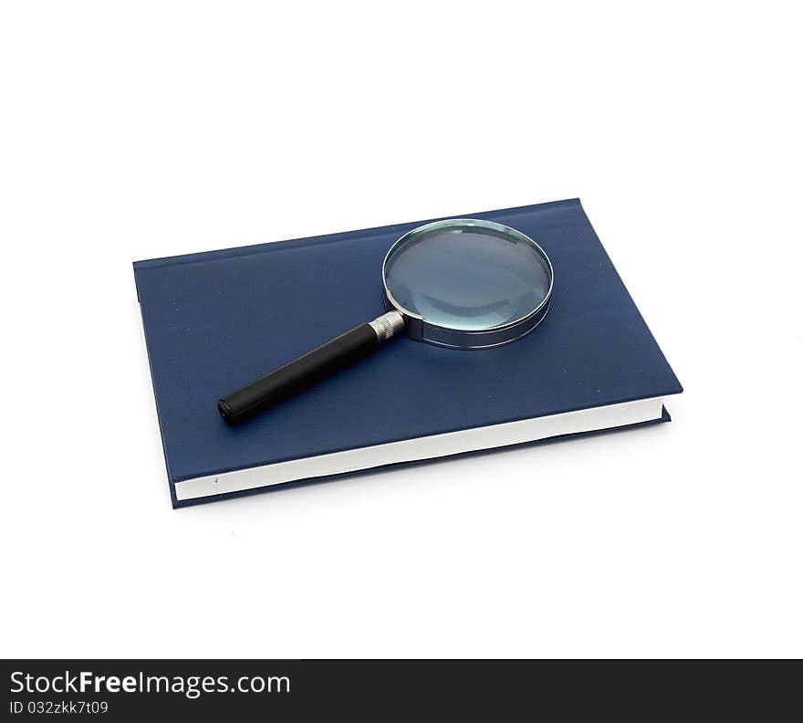 Magnifier and book isolated on a white background