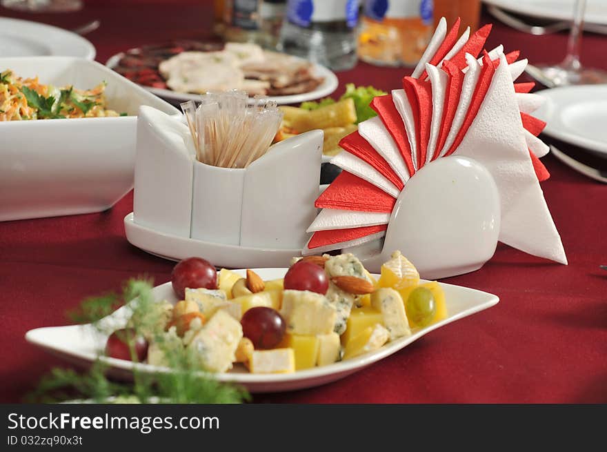 Appetizer, napkins on a celebratory banquet table. Appetizer, napkins on a celebratory banquet table.