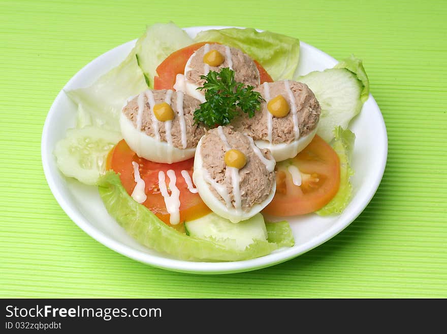 Healthy fresh salad on a plate with eggs, and tuna. Healthy fresh salad on a plate with eggs, and tuna