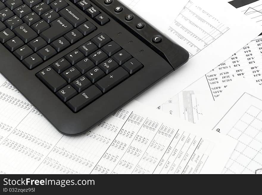 Financial balance. keyboard stands on stack document