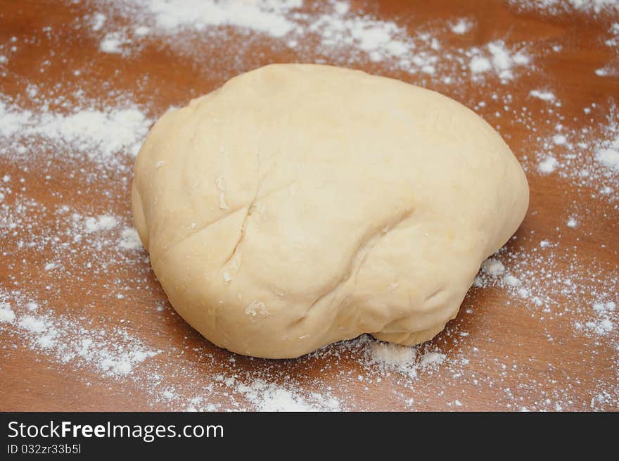 Dough with flour on a table