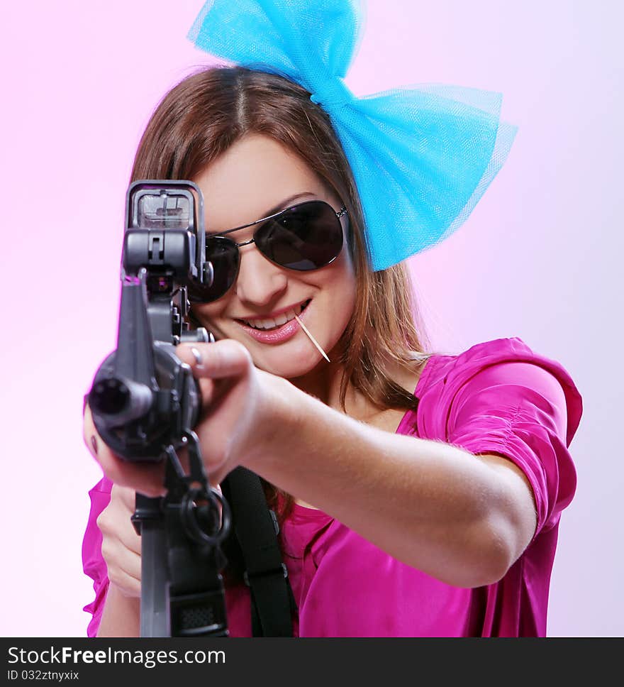 Attractive and spy womanl with assault rifle in red. Attractive and spy womanl with assault rifle in red