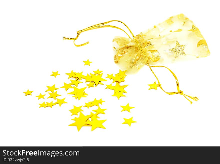 Golden pouch and stars on a white background