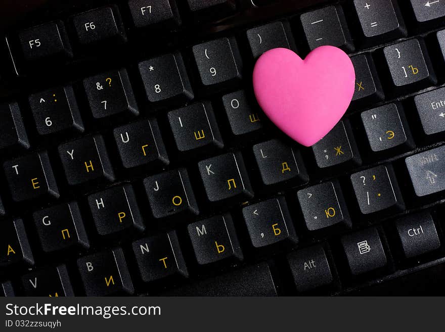 Pink heart on black keyboard. Pink heart on black keyboard