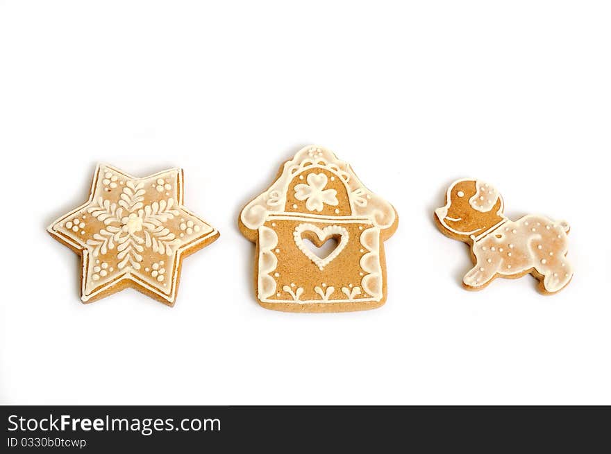 Various shapes of christmas gingerbread decorated with white topping