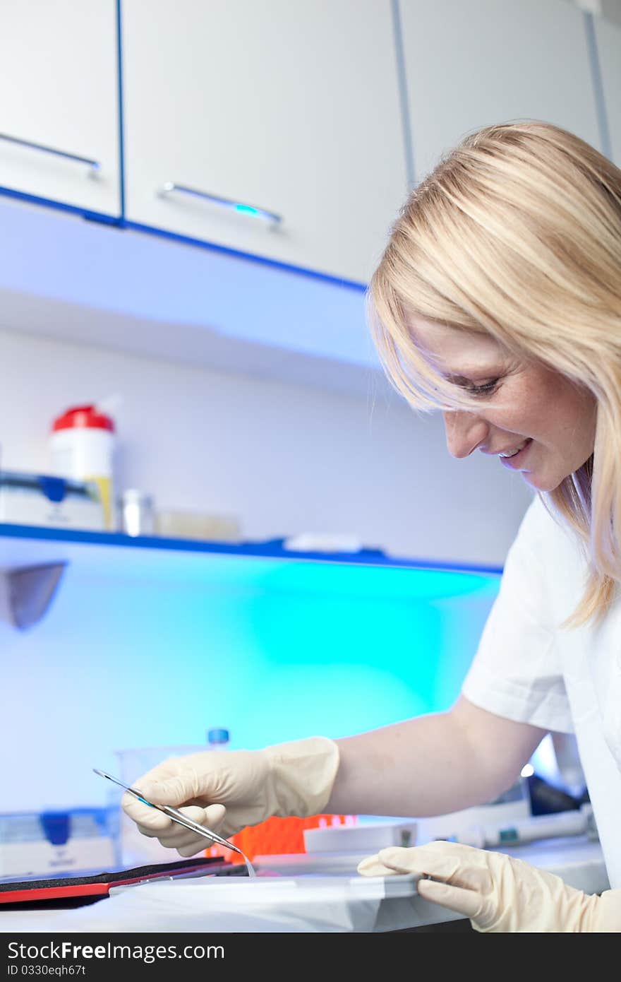 Portrait of a female researcher working in a lab