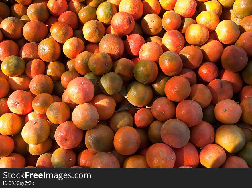 Background of orange tangerine fruits . Market. Background of orange tangerine fruits . Market.