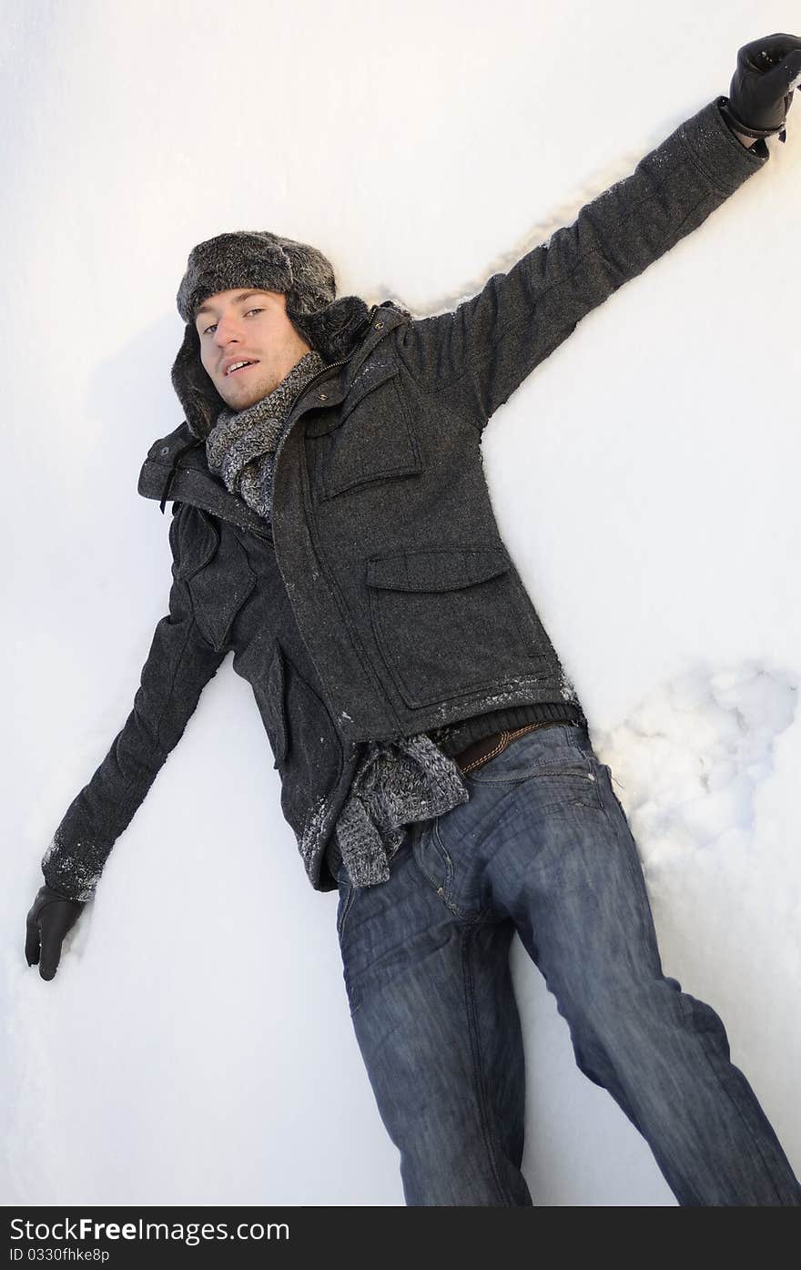 Man creating snow angels