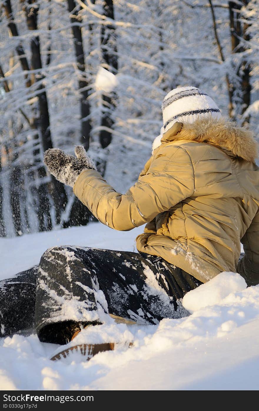 Teen fighting with snow balls