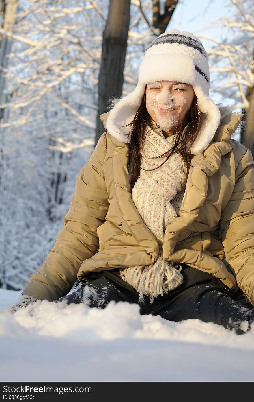 Girl having snow on face