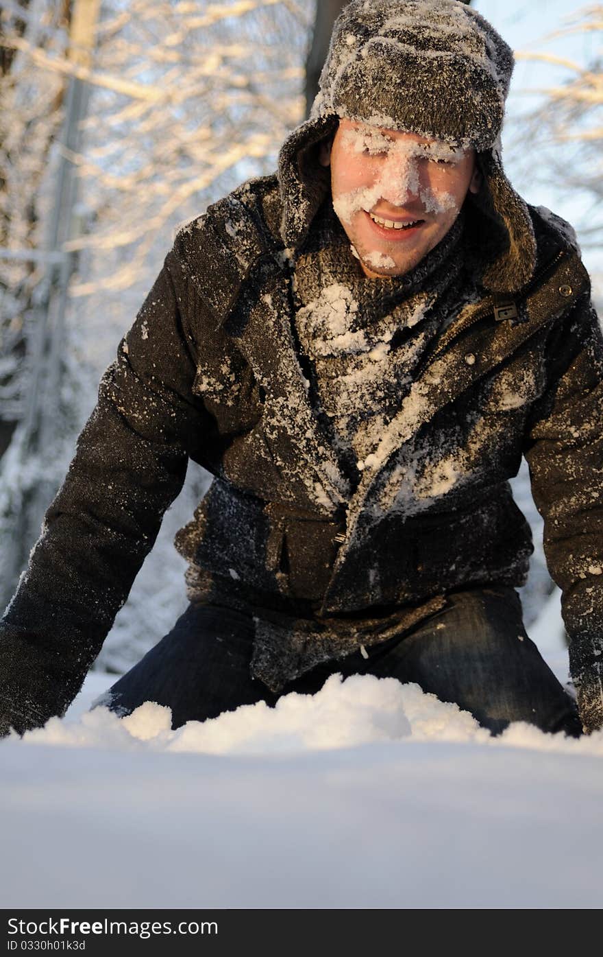 Boy playing with snow in forest, winter season. Boy playing with snow in forest, winter season