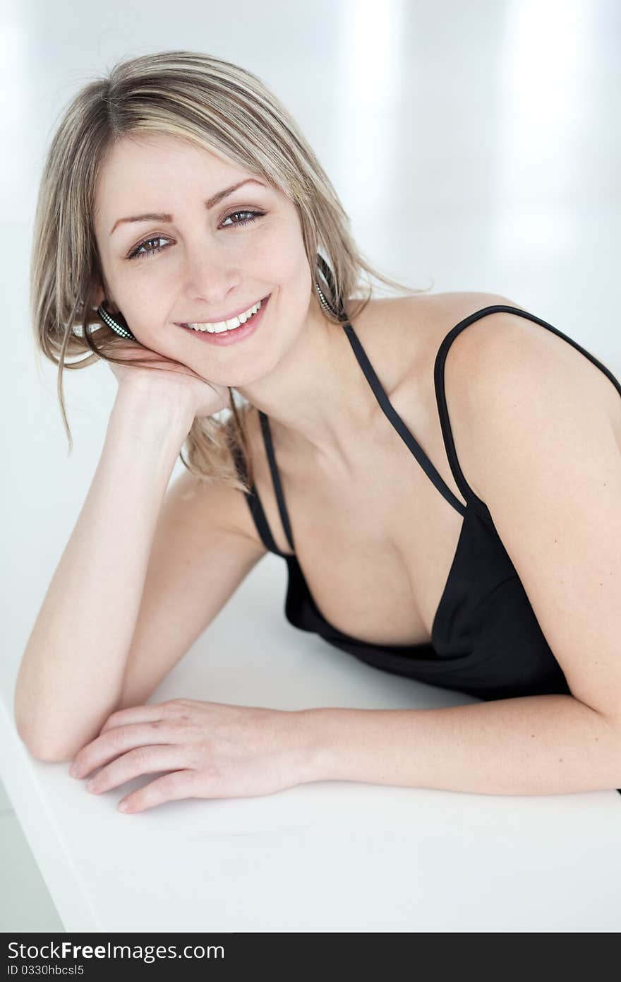 Portrait of a very pretty young woman wearing nice black dress, smiling. Portrait of a very pretty young woman wearing nice black dress, smiling