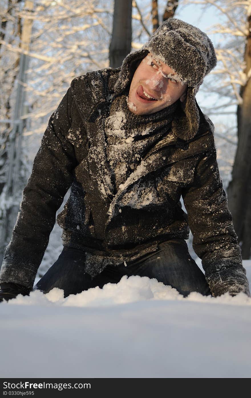 Boy playing with snow in forest, winter season. Boy playing with snow in forest, winter season