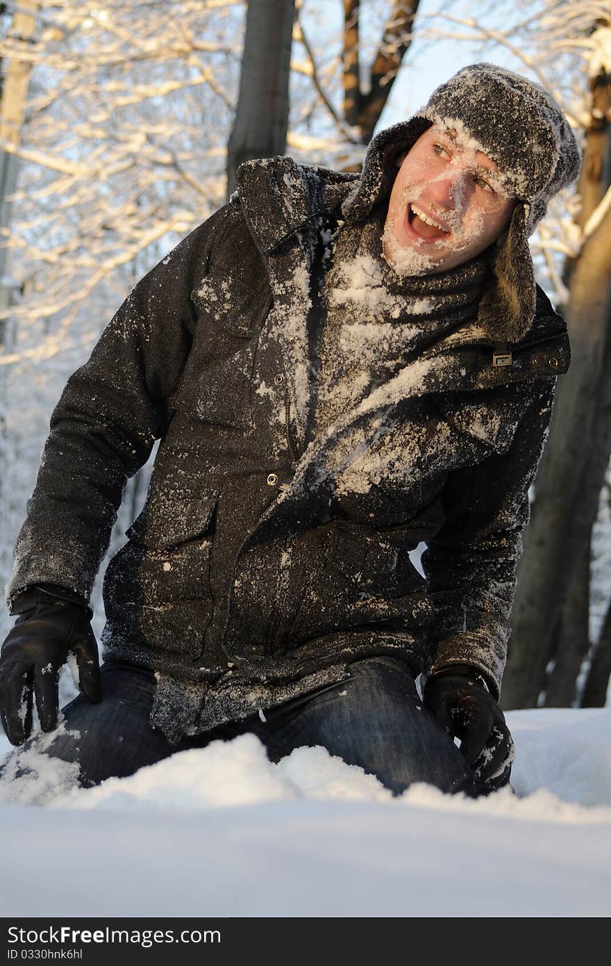 Boy playing with snow in forest, winter season. Boy playing with snow in forest, winter season