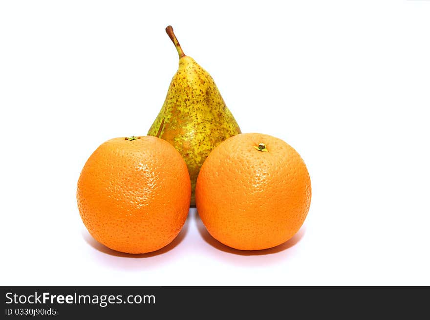 Photo of the pear and oranges on white background