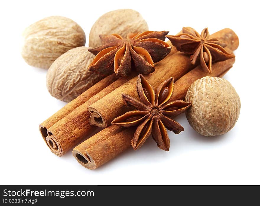 Cinnamon, anise and nutmeg on a white background. Cinnamon, anise and nutmeg on a white background