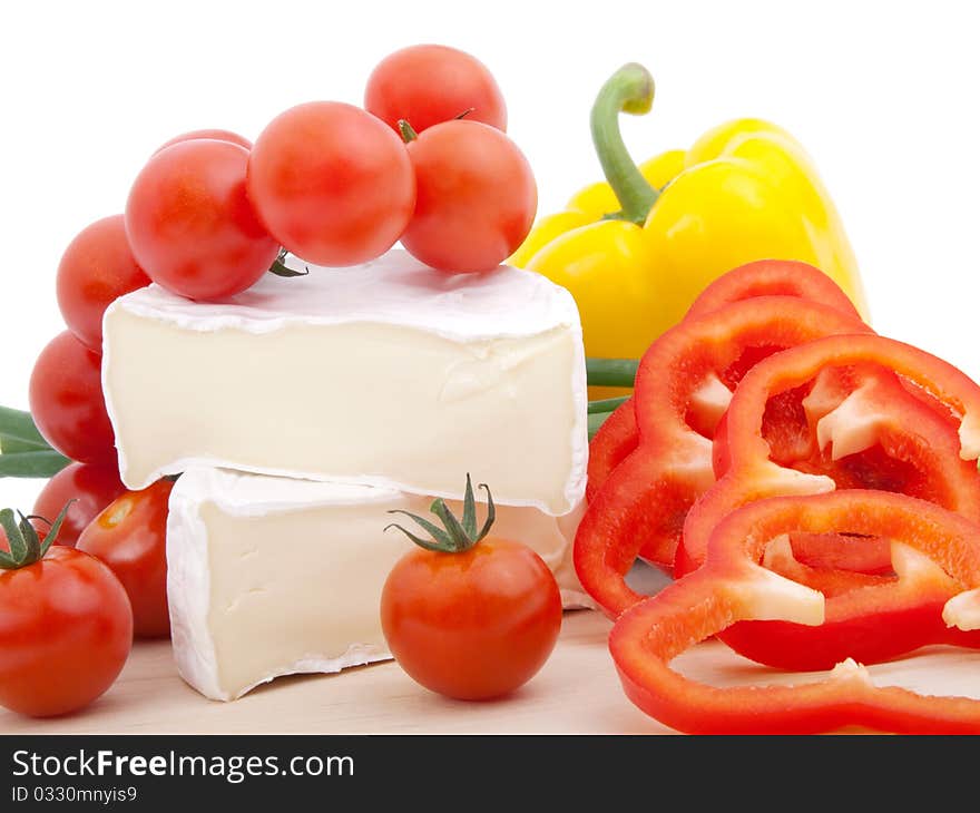 Wheel of French cheese with vegetables