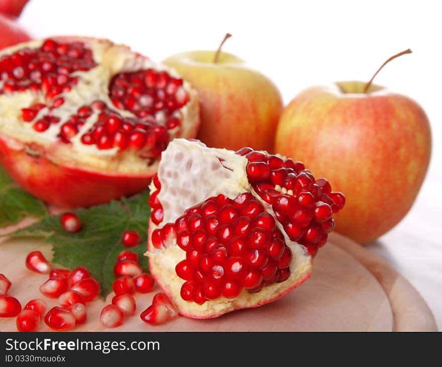 Pomegranate fruit, isolated on white background