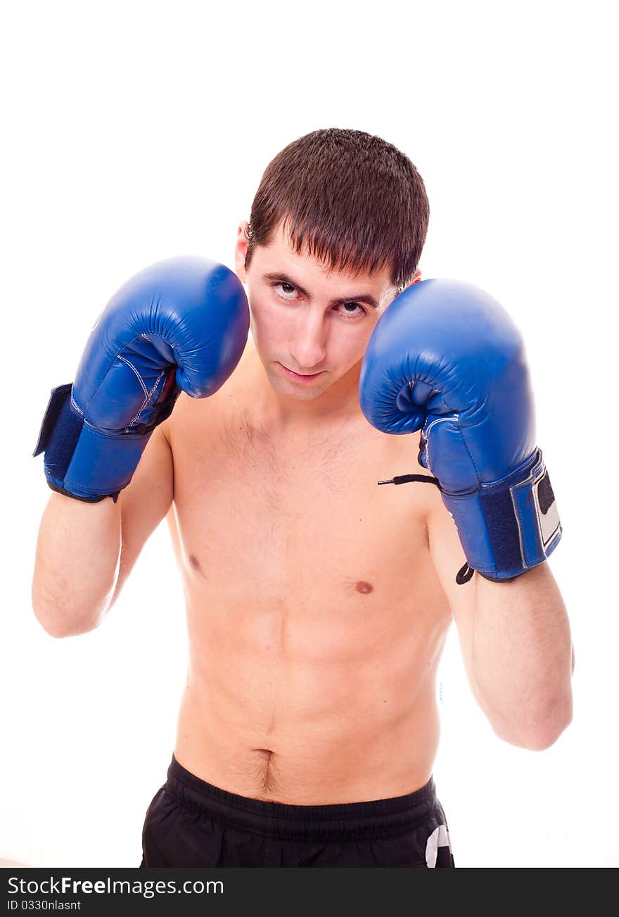 Young man in a boxing gloves. Young man in a boxing gloves