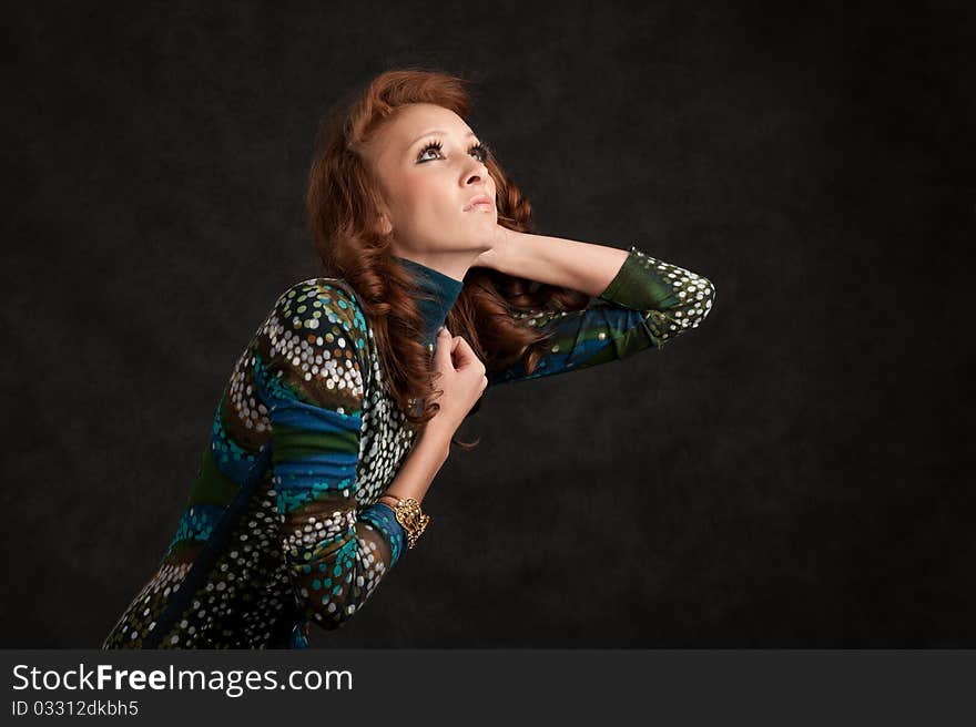 Portrait of a beautiful girl. Dark background