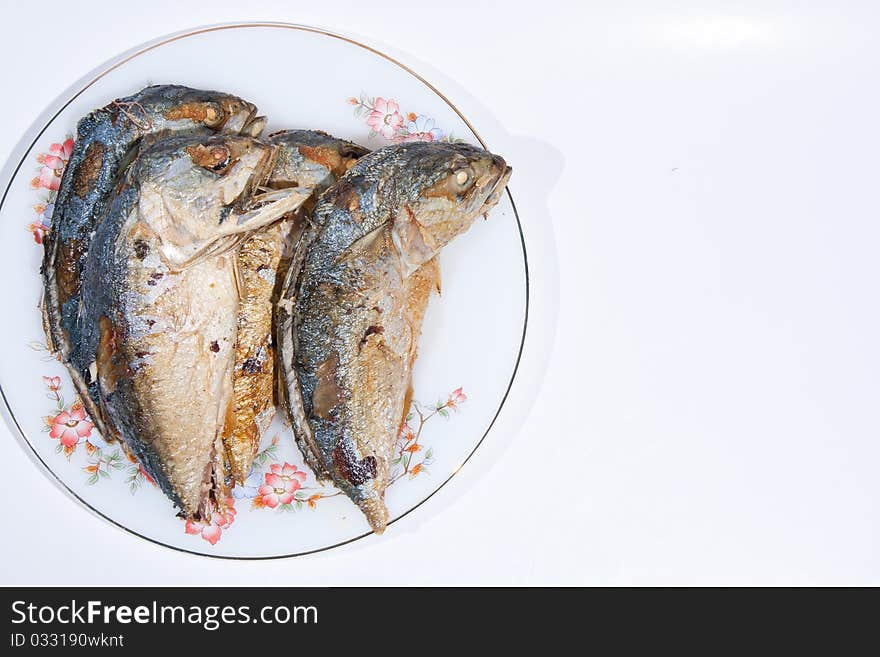 Division Two fish fry held on the plate insert. On a white background. Division Two fish fry held on the plate insert. On a white background.