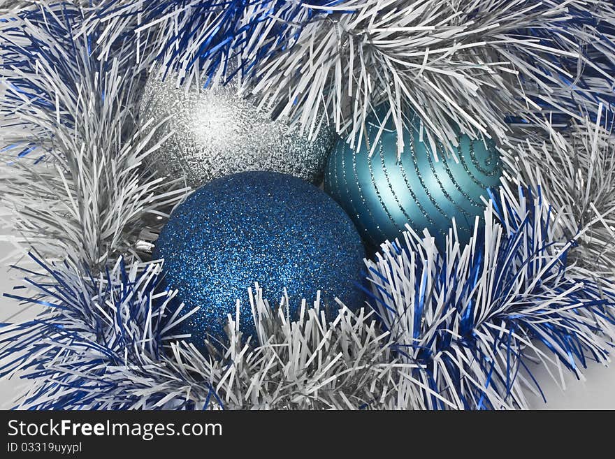 Christmas balls and blue paper streamer