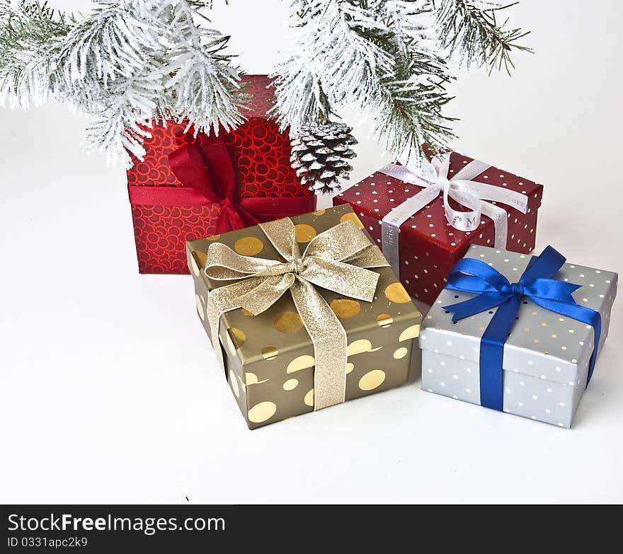 Different colour gift boxes and christmas tree