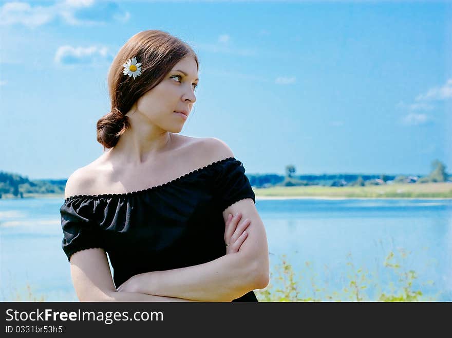 Pretty young woman with camomile in hair. Pretty young woman with camomile in hair