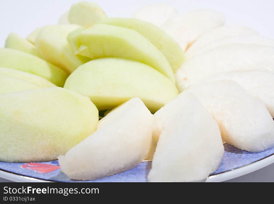 Apples, peeled and wheat. Sort palatable Arranged on the plate insert. On a white background.