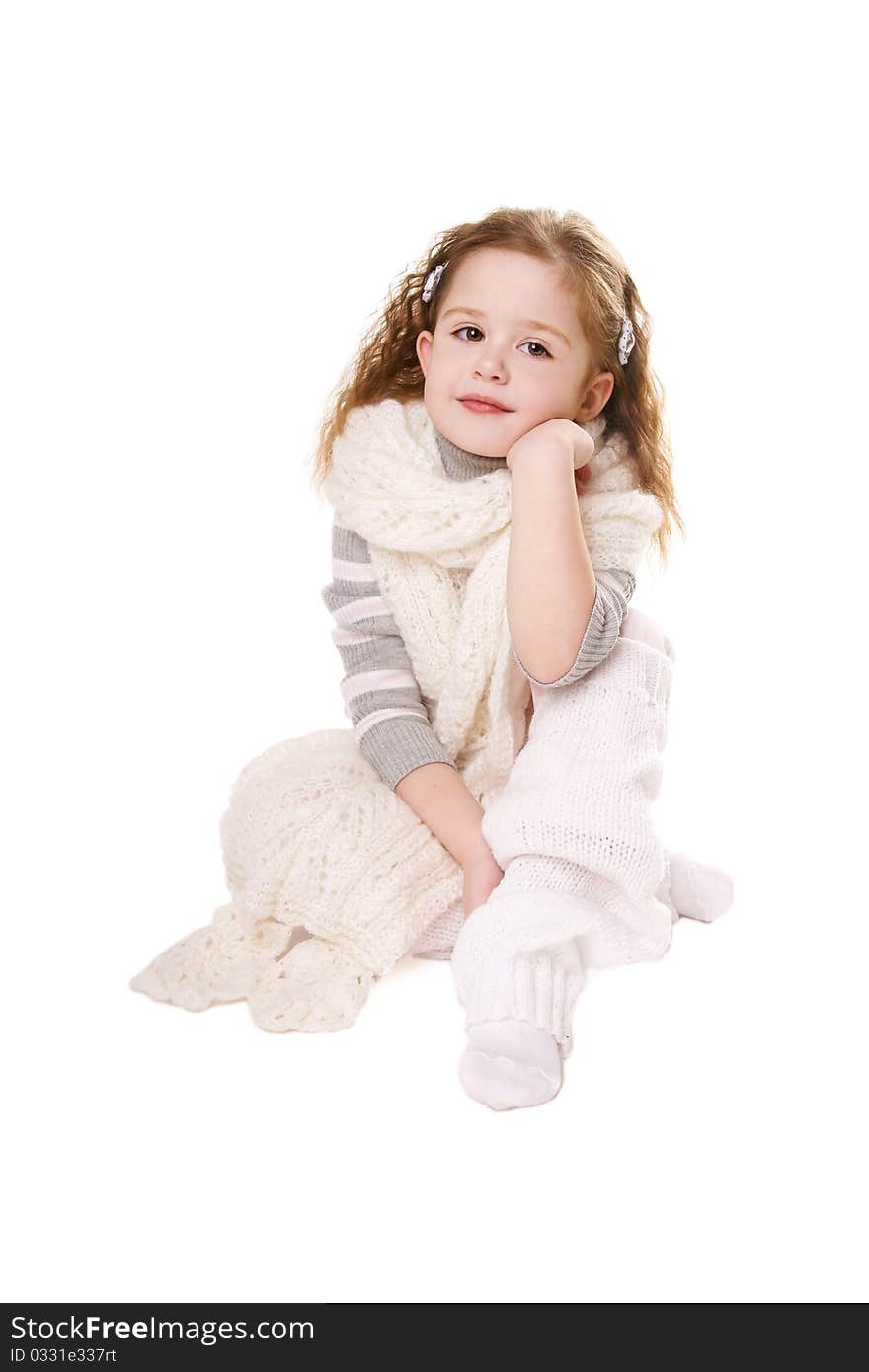 Smiling little girl in scarf isolated on white background