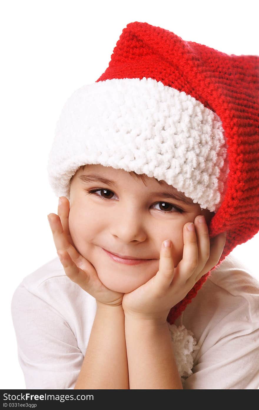 Portrai of happy smiling beautiful little boy in hat of Santa Claus isolated on white background. Portrai of happy smiling beautiful little boy in hat of Santa Claus isolated on white background