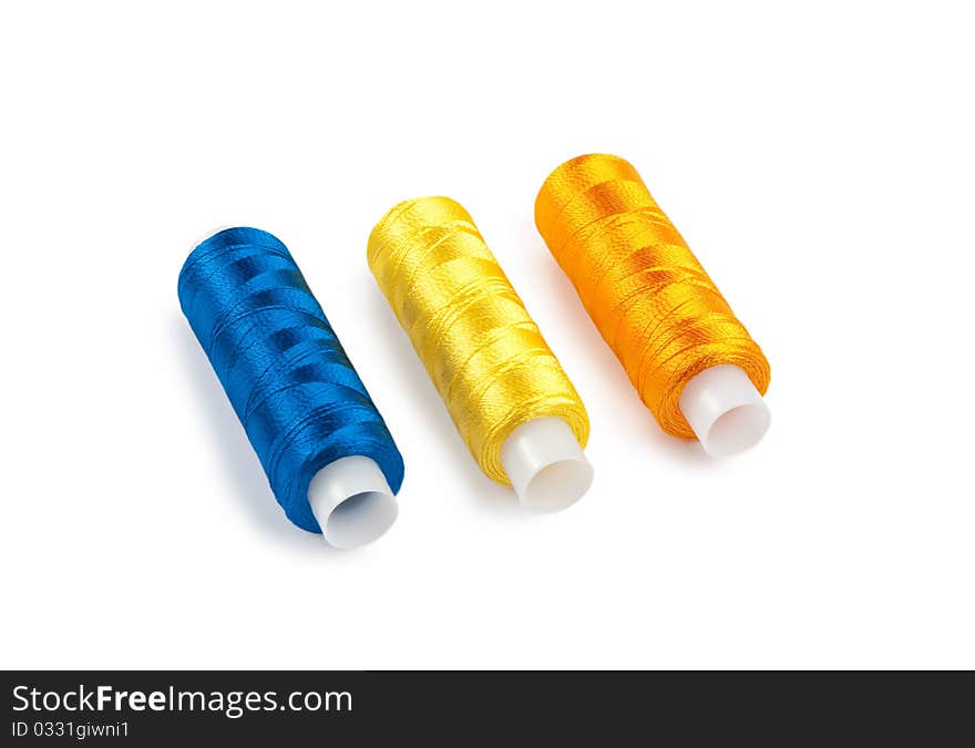 Blue, yellow and orange spools