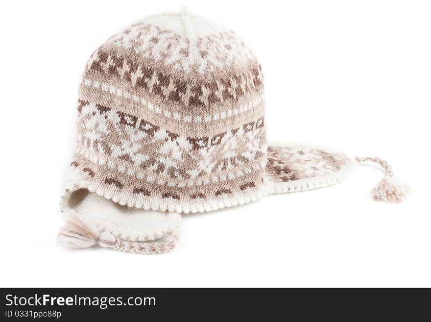 Warm knitted scarf and cap isolated on a white background